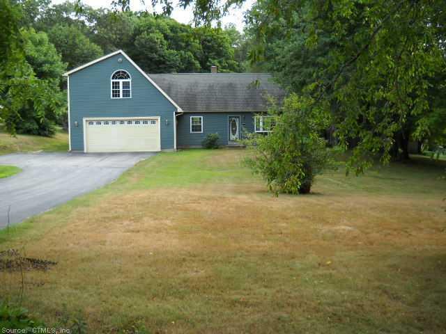 89 Thompson Hill Road Thompson, CT 06255 - Photo 1 of 1 a house with trees in front of it