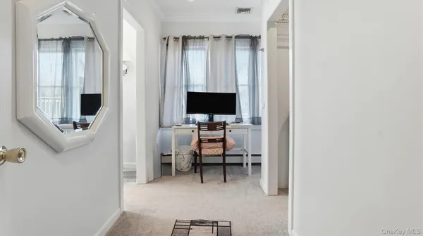 a view of a livingroom with a flat screen tv