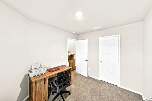 a view of a workspace with furniture