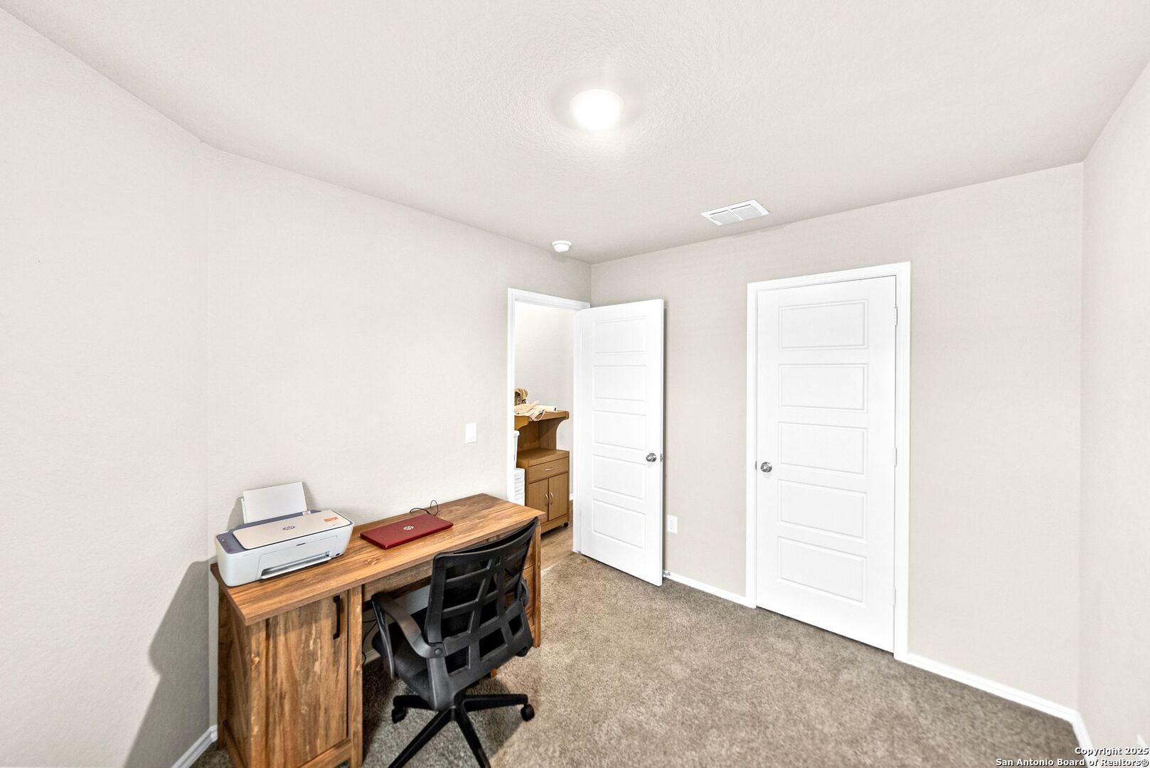 19911 Wyatt Earp Way Lytle, TX 78052 - Photo 19 of 26 a view of a workspace with furniture