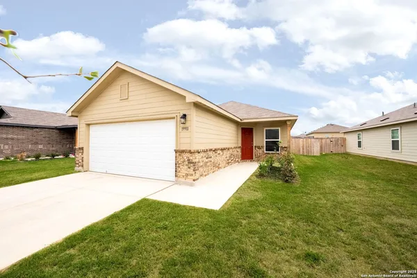 a view of a backyard of the house