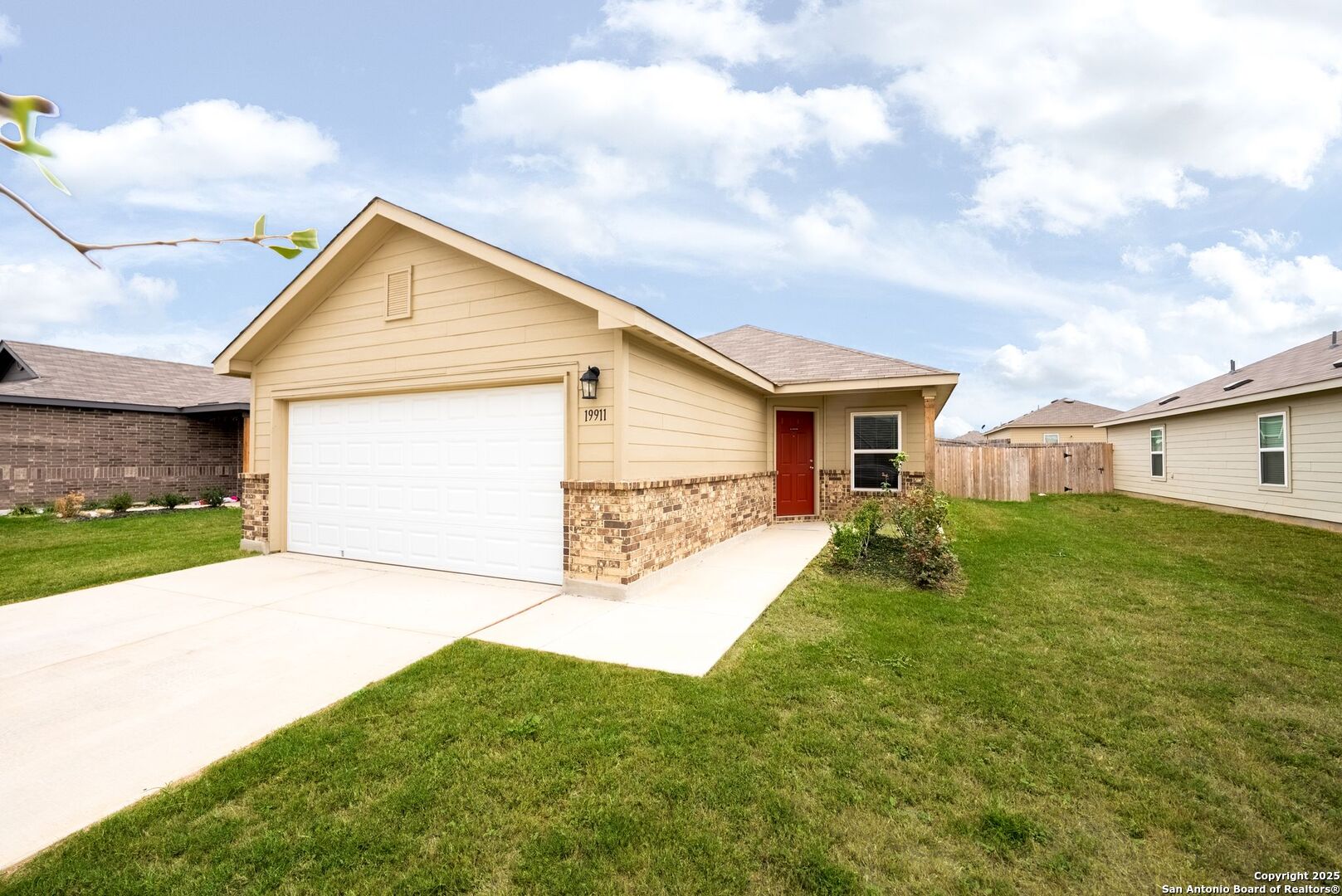 19911 Wyatt Earp Way Lytle, TX 78052 - Photo 2 of 26 a view of a backyard of the house