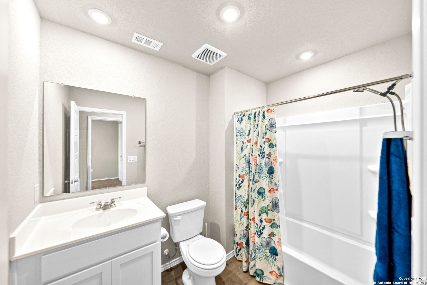 19911 Wyatt Earp Way Lytle, TX 78052 - Photo 21 of 26 a bathroom with a sink toilet and shower