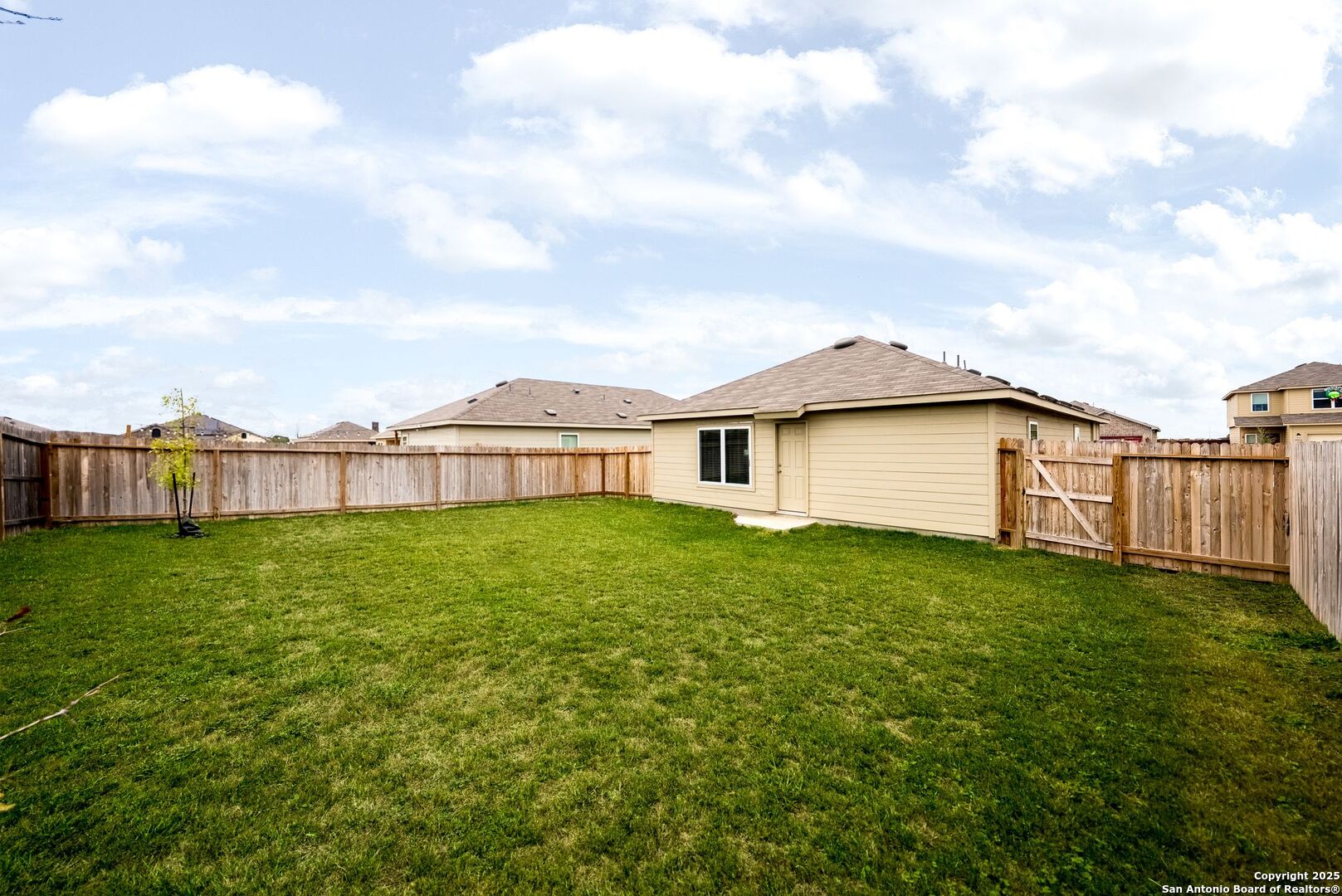 19911 Wyatt Earp Way Lytle, TX 78052 - Photo 24 of 26 a view of a yard with a house
