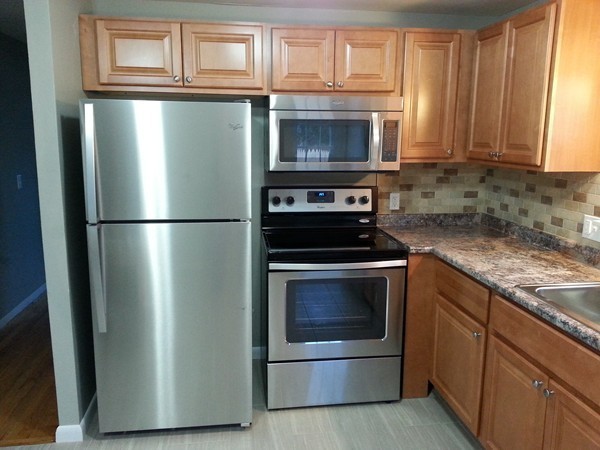 70 Starling Road Springfield, MA 01119 - Photo 11 of 25 a kitchen with stainless steel appliances granite countertop a refrigerator stove and microwave
