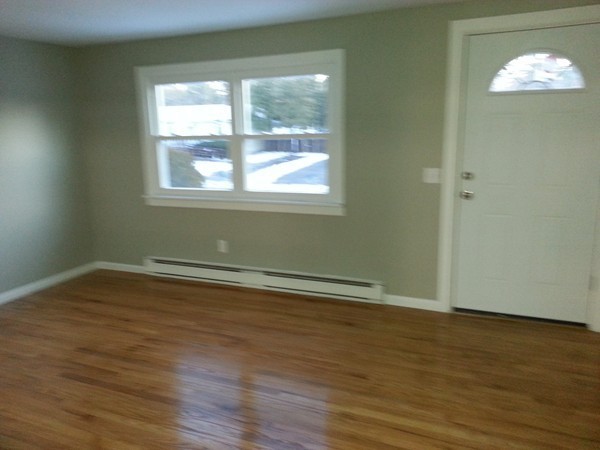 70 Starling Road Springfield, MA 01119 - Photo 13 of 25 an empty room with wooden floor and windows