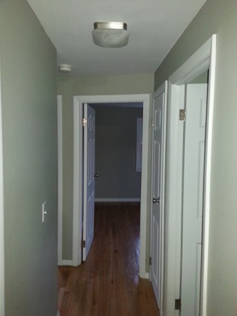 70 Starling Road Springfield, MA 01119 - Photo 16 of 25 a view of a hallway with wooden floor