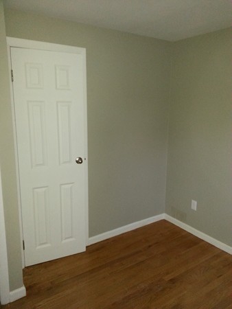 70 Starling Road Springfield, MA 01119 - Photo 17 of 25 a view of an empty room with wooden floor
