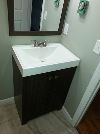 70 Starling Road Springfield, MA 01119 - Photo 20 of 25 a bathroom with a sink and a mirror
