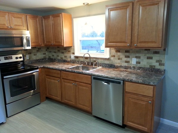 70 Starling Road Springfield, MA 01119 - Photo 2 of 25 a kitchen with granite countertop a sink cabinets stainless steel appliances and a window