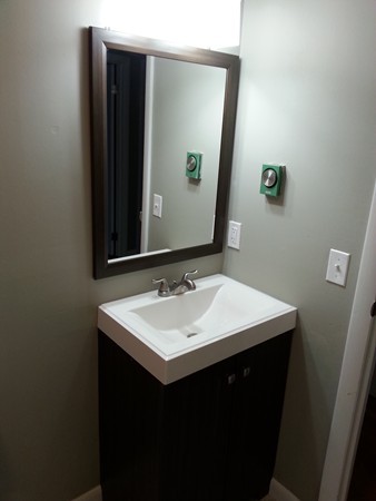 70 Starling Road Springfield, MA 01119 - Photo 21 of 25 a bathroom with a sink and a mirror