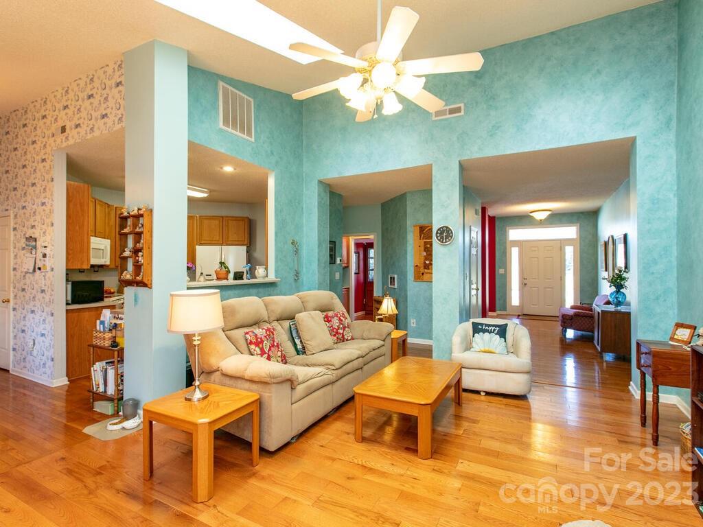 256 Walnut Crest Road Fletcher, NC 28732 - Photo 6 of 38 a living room with furniture and a chandelier
