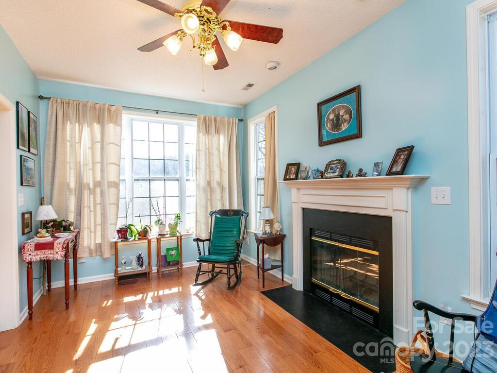 256 Walnut Crest Road Fletcher, NC 28732 - Photo 7 of 38 a living room with furniture and a fireplace