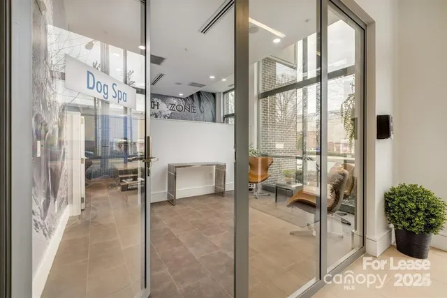 a lobby with furniture and a large window