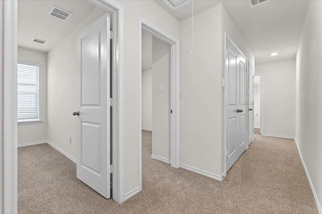 a view of a hallway with closet area