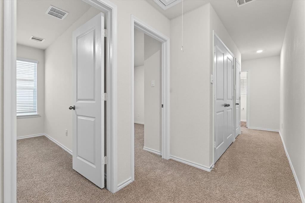 331 Clematis Street Princeton, TX 75407 - Photo 10 of 19 a view of a hallway with closet area