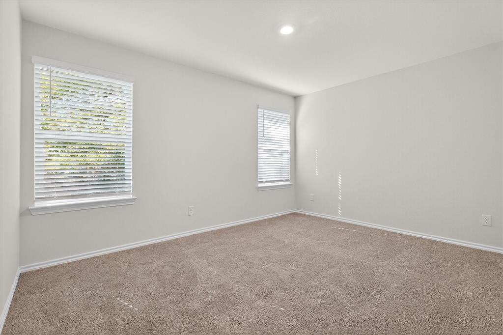 331 Clematis Street Princeton, TX 75407 - Photo 11 of 19 a view of an empty room with a window