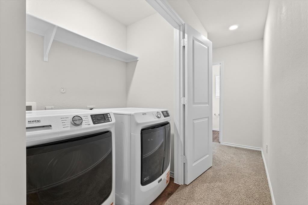 331 Clematis Street Princeton, TX 75407 - Photo 17 of 19 a utility room with dryer and washer