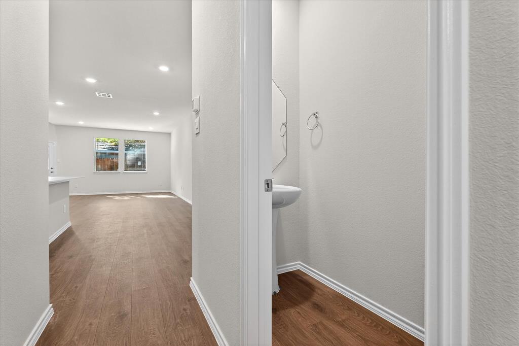 331 Clematis Street Princeton, TX 75407 - Photo 3 of 19 a view of hallway with wooden floor