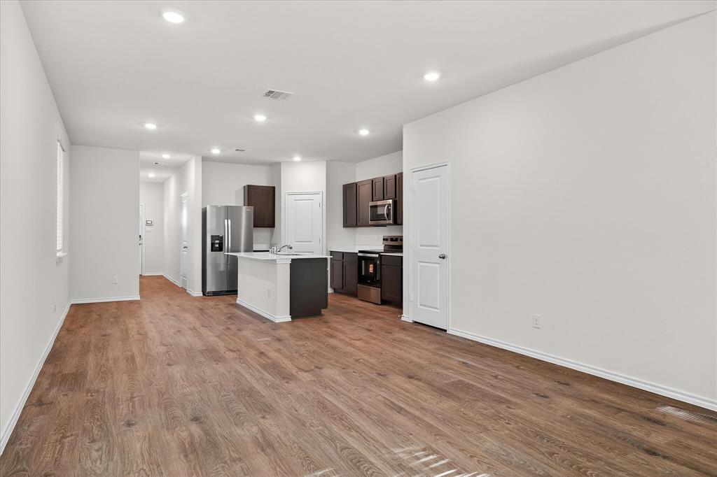 331 Clematis Street Princeton, TX 75407 - Photo 6 of 19 a view of kitchen with wooden floor