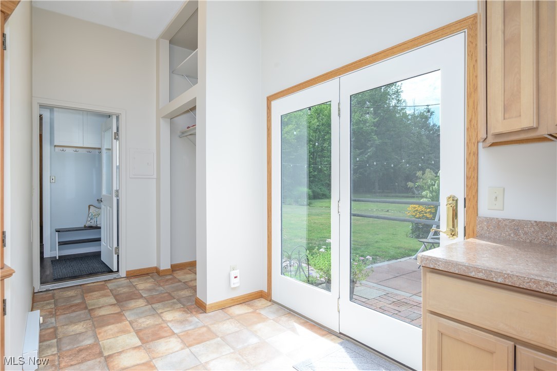 6640 Giddings Road Rootstown, OH 44272 - Photo 47 of 49 Doorway to outside featuring baseboards