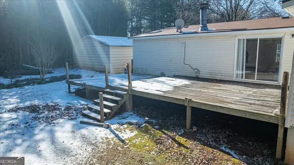 a view of a backyard with a chair and table