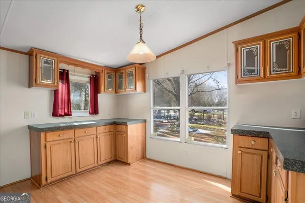 a view of a kitchen and microwave