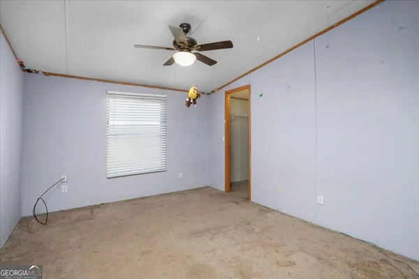 a view of an empty room with a window