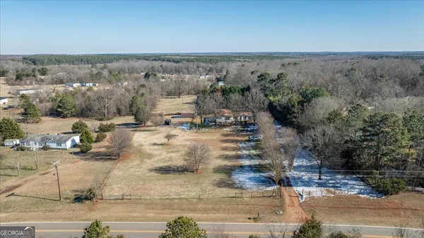 an aerial view of residential houses with outdoor space