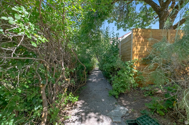 510 Spring Creek Road Providence, UT 84332 - Photo 74 of 97 Gravel pathway framed by dense foliage and mature trees