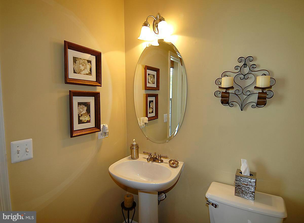 44047 Rising Sun Terrace Ashburn, VA 20147 - Photo 18 of 30 a bathroom with a sink and mirror