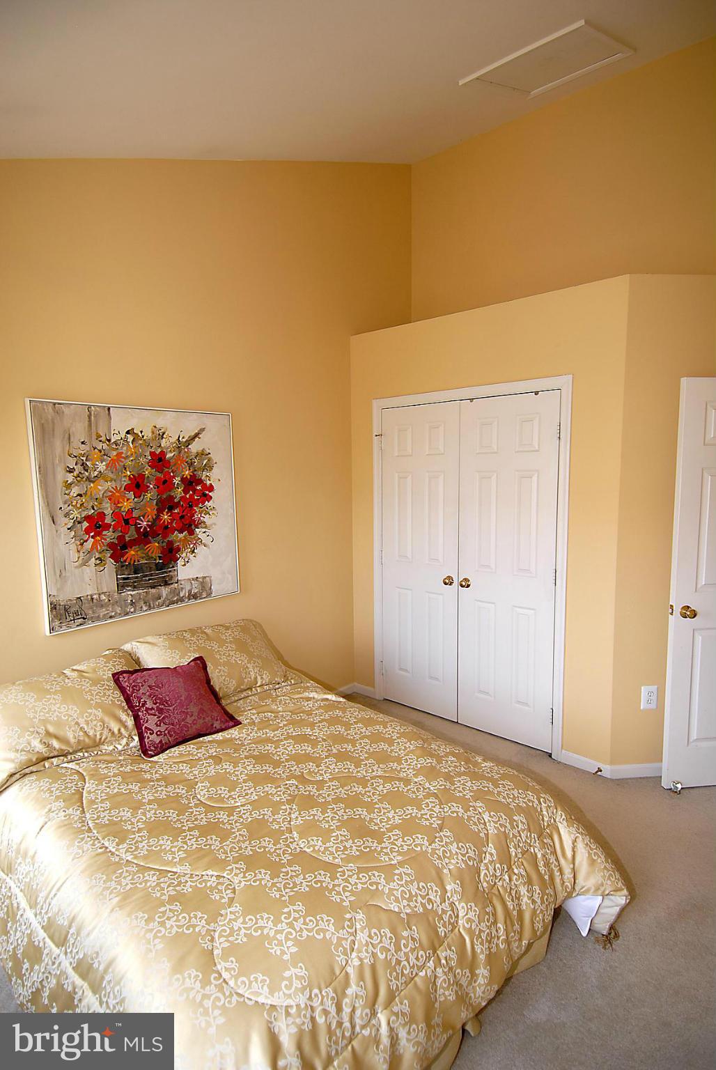 44047 Rising Sun Terrace Ashburn, VA 20147 - Photo 26 of 30 a bedroom with a bed and painting on the wall
