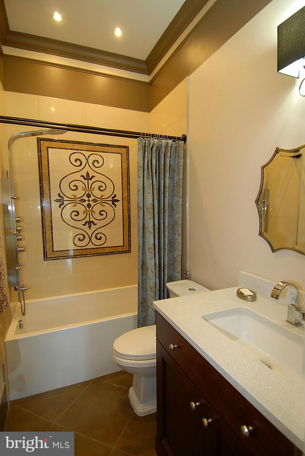 44047 Rising Sun Terrace Ashburn, VA 20147 - Photo 27 of 30 a bathroom with a sink a toilet and a bathtub