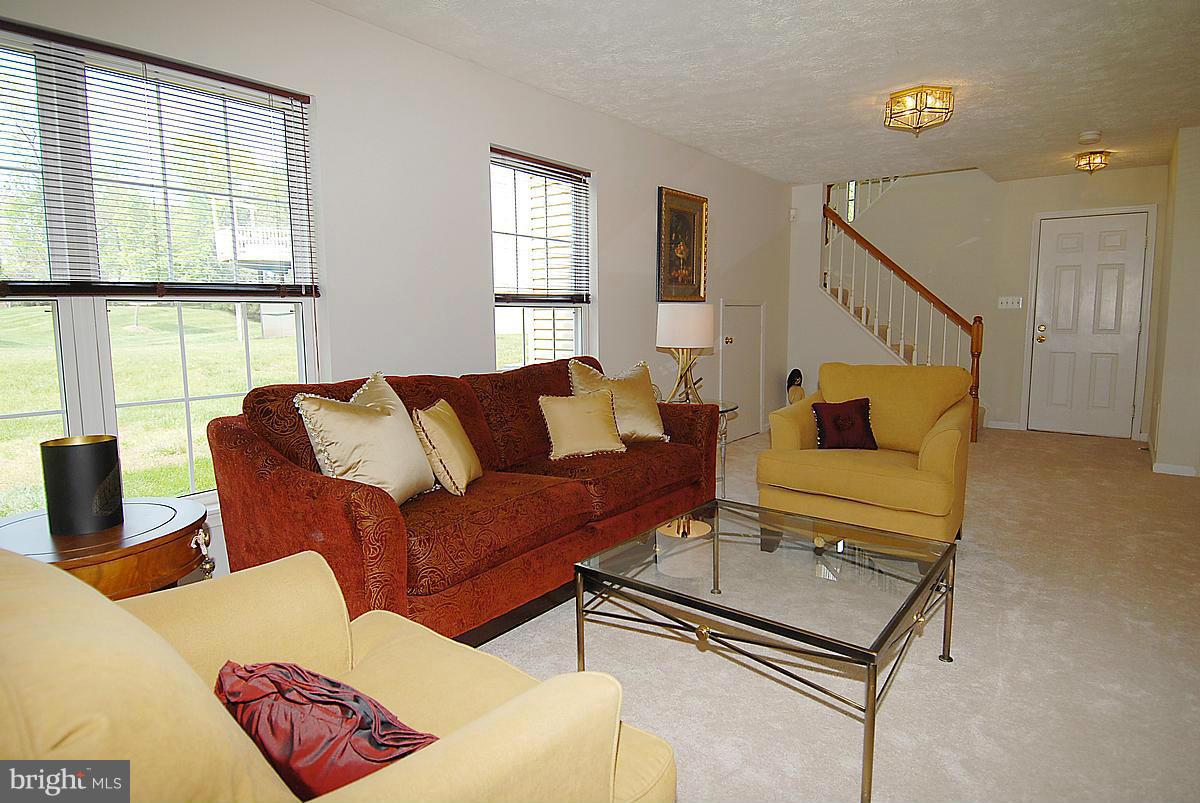44047 Rising Sun Terrace Ashburn, VA 20147 - Photo 29 of 30 a living room with furniture and a window