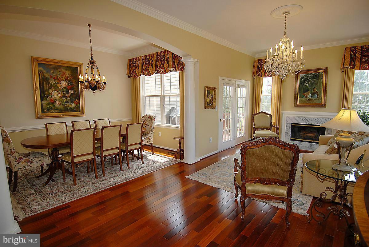 44047 Rising Sun Terrace Ashburn, VA 20147 - Photo 9 of 30 a view of a dining room with furniture window and wooden floor