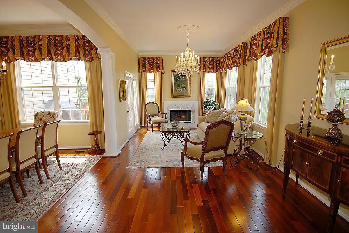 44047 Rising Sun Terrace Ashburn, VA 20147 - Photo 10 of 30 a living room with furniture and a wooden floor