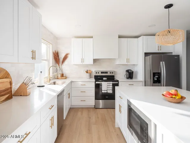 a kitchen with a sink stove and refrigerator