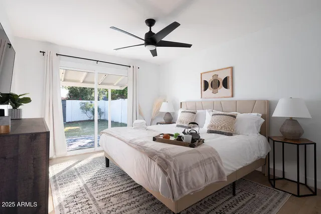 a bedroom with bed and a window