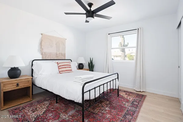 a bedroom with a bed and a window