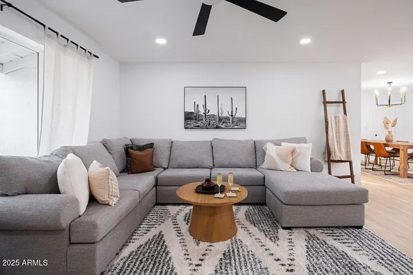 a living room with furniture and a rug