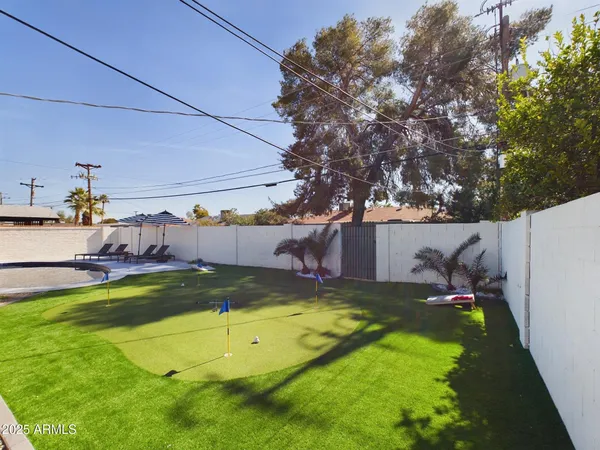 a view of swimming pool with a yard