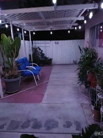 a view of a porch with potted plants