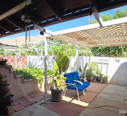 a view of a chairs and table in patio