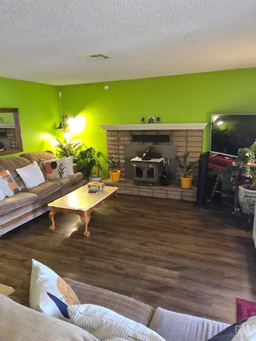 a view of a living room and kitchen