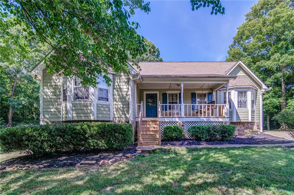 2198 Upper Burris Road Ball Ground, GA 30107 - Photo 1 of 1 a view of a house with a yard and potted plants