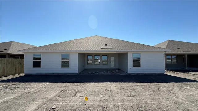 a front view of a house with yard