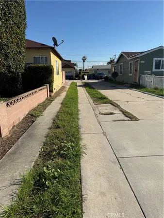 a view of a backyard with sitting area