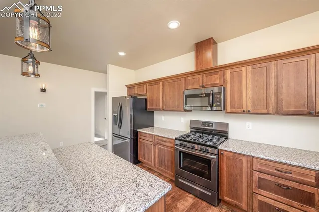 an empty room with a ceiling fan and window