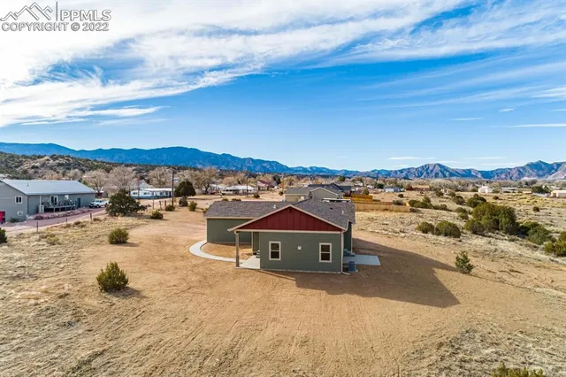 a bathroom with a toilet and a shower curtain