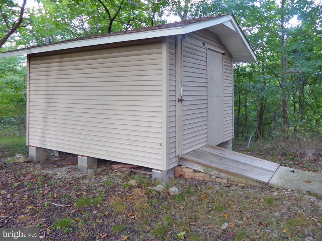 135 Farm Ridge Road Front Royal, VA 22630 - Photo 9 of 50 Large shed with sliding door and drive-up ramp
